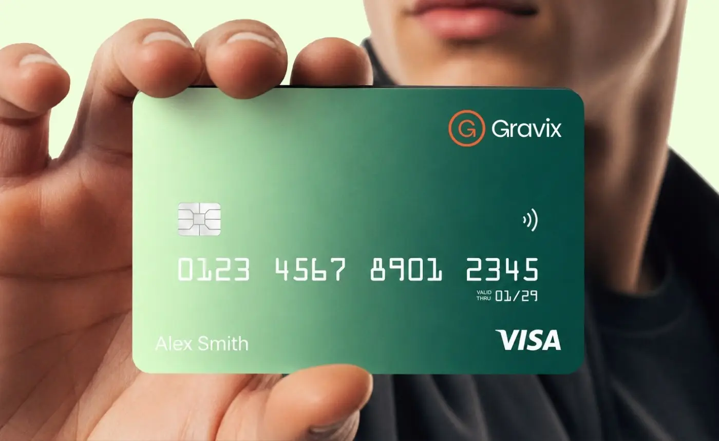 Gravix bank card held in a hand