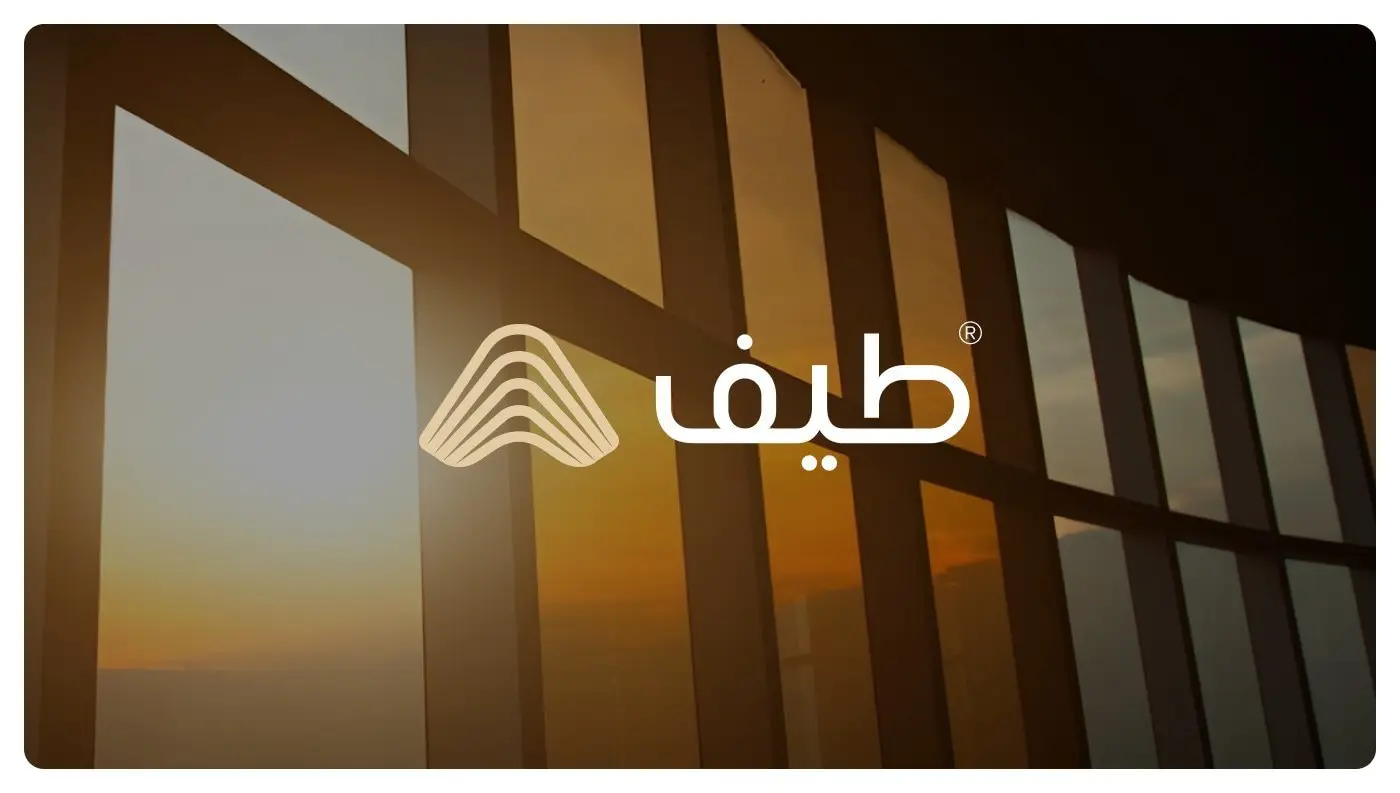 Taif logo on a sunlit window